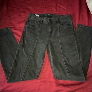 Black denim mid rise skinny jeans w/ slit at ankles